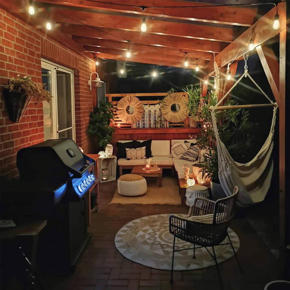 Terrace with a barbeque and string lights