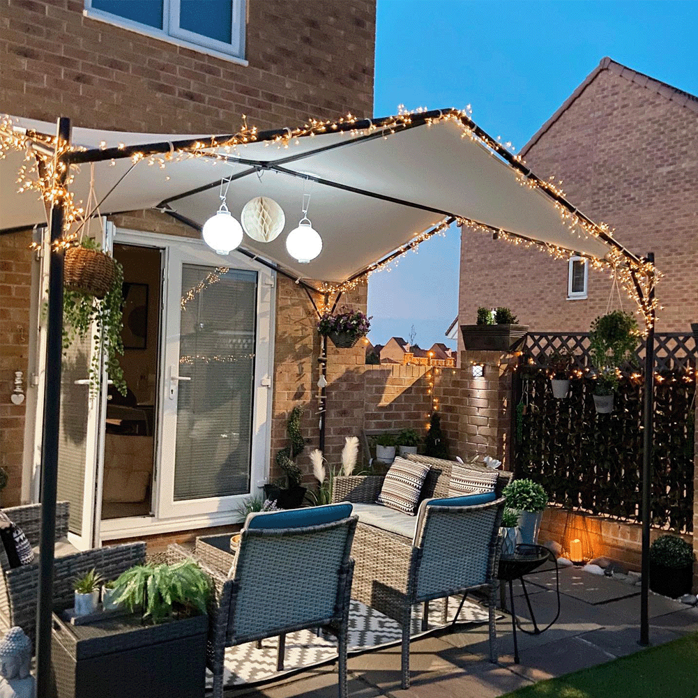 Backyard terrace with decorative lights on the awning